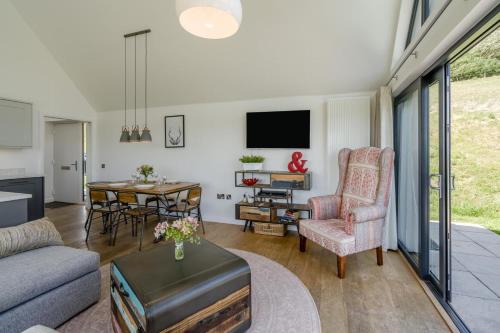a living room with a couch and a table at 2 Bed in Newburgh oc-g32594 in Newburgh