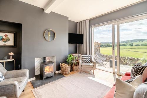 a living room with a fireplace and a window at 2 Bed in Newburgh oc-f32595 in Newburgh