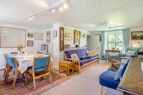 a living room with a table and a dining room at 2 Bed in Stalham oc-u32571 in Stalham