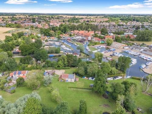 an aerial view of a town with a marina at 2 Bed in Stalham oc-u32571 in Stalham