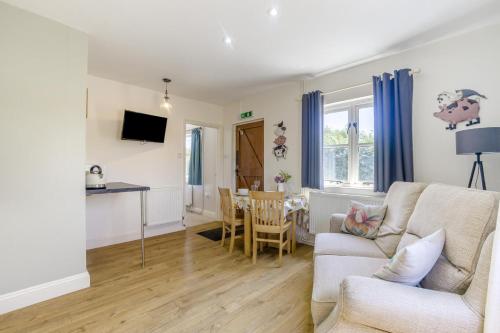 a living room with a couch and a table at 1 Bed in Great Sampford oc-f32654 in Great Sampford