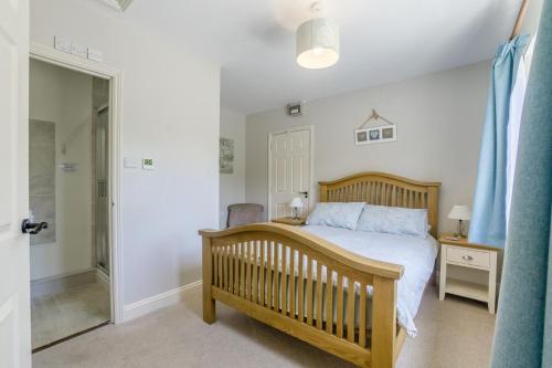 a bedroom with a bed and a walk in shower at 1 Bed in Great Sampford oc-f32654 in Great Sampford