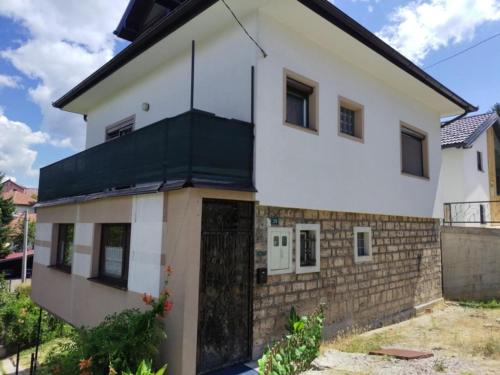 a house with a black roof at Hiža Guesthouse in Sarajevo