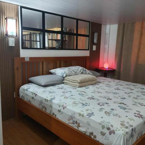 Postel nebo postele na pokoji v ubytování White Oak Residences - Baguio Megatower 3