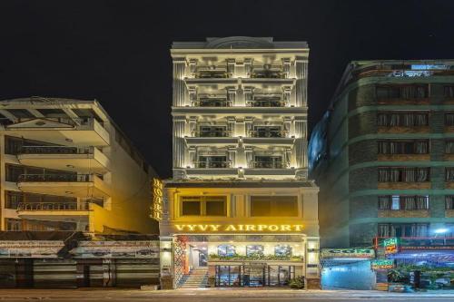 a tall building with aasy airport sign in front of it at Belvilla Near Tan Son Nhat International Airport - Formerly Vyvy Hotel in Ho Chi Minh City