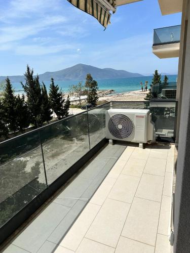 a balcony with a view of the beach at DeSa Radhime in Radhimë