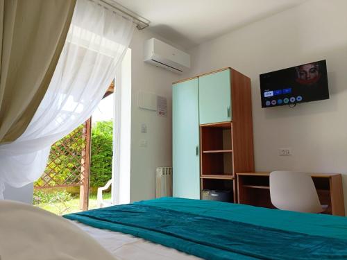 TV a/nebo společenská místnost v ubytování Albergo ristorante Elena