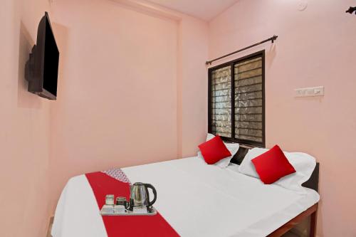 Ένα ή περισσότερα κρεβάτια σε δωμάτιο στο Hotel O R K Guest House