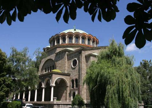 a building with a dome on top of it at Simply The Best - Vitosha blvd in Sofia
