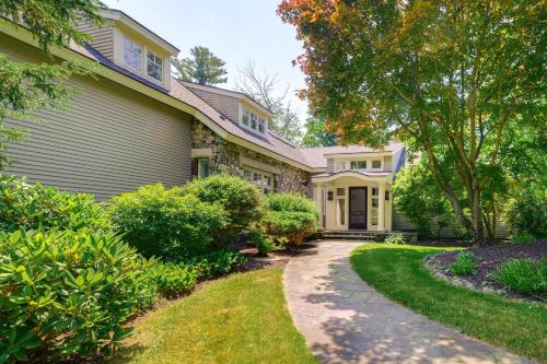 a house with a walkway in front of it at 18 Mi to Boston - Stylish Unit in Upscale Enclave! in Weston