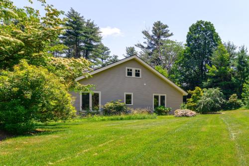 a house with a yard with green grass at 18 Mi to Boston - Stylish Unit in Upscale Enclave! in Weston