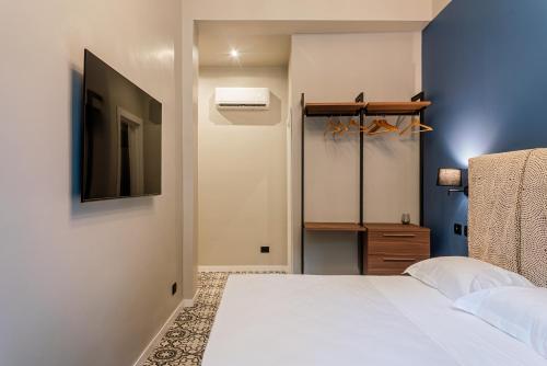 Letto o letti in una camera di Fontana Falconieri Boutique Hotel