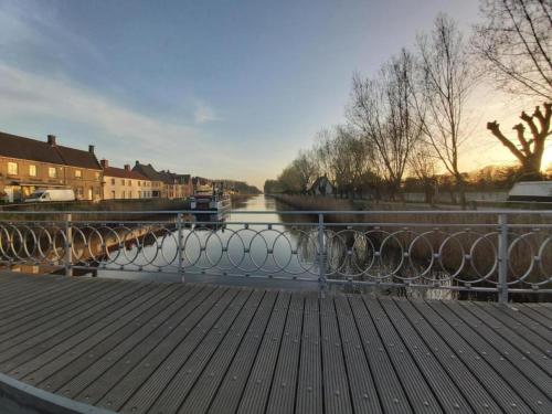 a view of a river from a wooden walkway at Apartment in Maldegem with Scenic Terrace in Maldegem