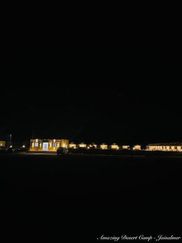 a train is on the tracks at night at Amazing Desert Camp in Jaisalmer
