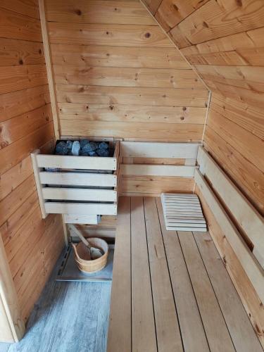 a wooden sauna with a bench in the middle at APARTMA-SPA NATURA in Sveti Jurij ob Ščavnici