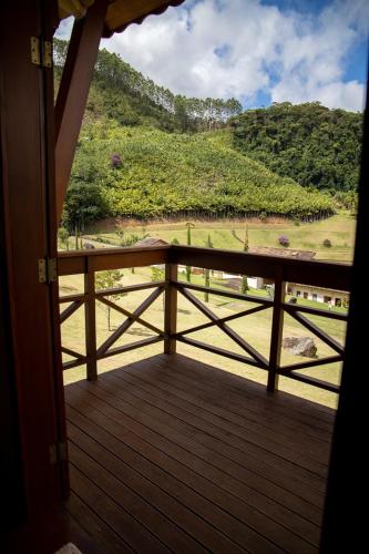 a view from a porch with a view of a mountain at Pousada Bela Aurora in Venda Nova do Imigrante