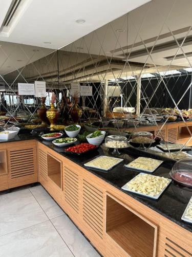 a buffet line with many different types of food at City Center Hotel Taksim İstanbul in Istanbul
