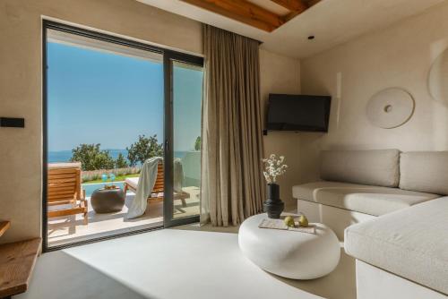 Ένα ή περισσότερα κρεβάτια σε δωμάτιο στο Orizontas Suites