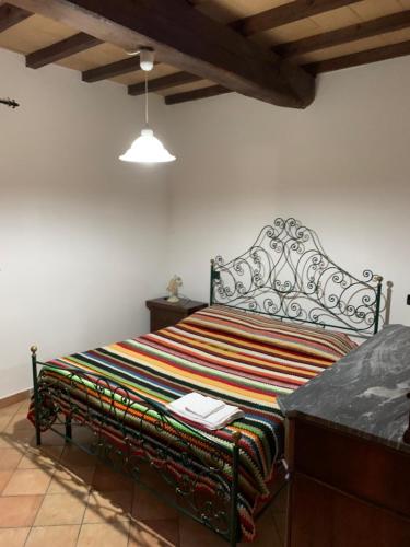 Una cama o camas en una habitación de Residenza Le Querce Bilocale