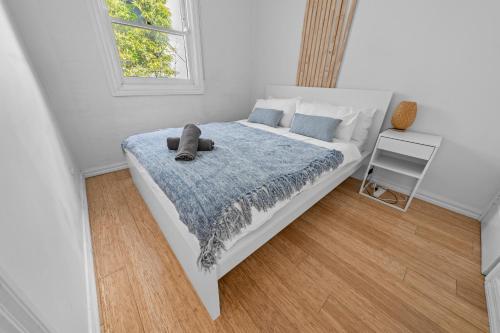 Ένα ή περισσότερα κρεβάτια σε δωμάτιο στο 3-Bedroom House in Ultimo Good for 10 Guests