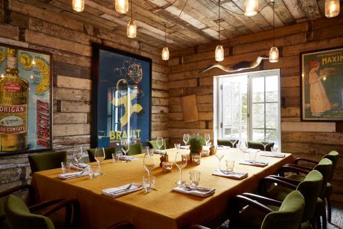 a dining room with a long table and chairs at Artist Residence Cornwall in Penzance