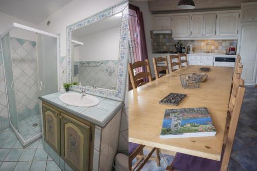 a kitchen with a sink and a counter with a mirror at Gites au Cœur de la Nature, Piscine et Vue sur le Lac du Salagou in Le Puech