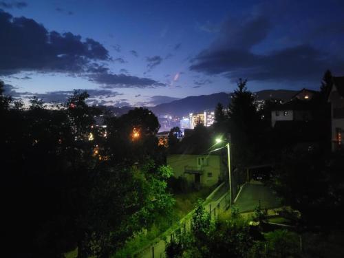 a city at night with a street light at Hiža Guesthouse in Sarajevo