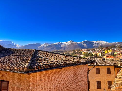a view of a city with mountains in the background at Borgoloco in Sarnano
