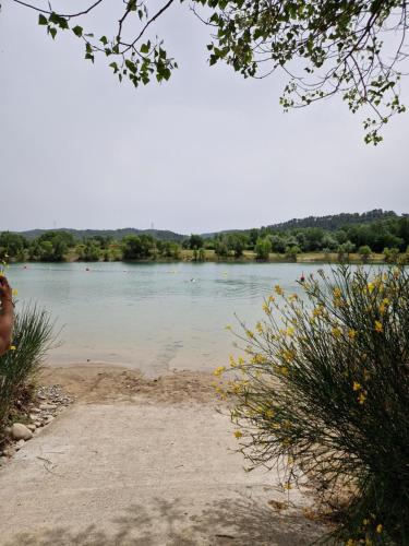 a view of a body of water at Mobil home en Provence - Camping 4 étoiles- 2 chambres -4 à 6 pers-clim-terrasse-TV in Cadenet