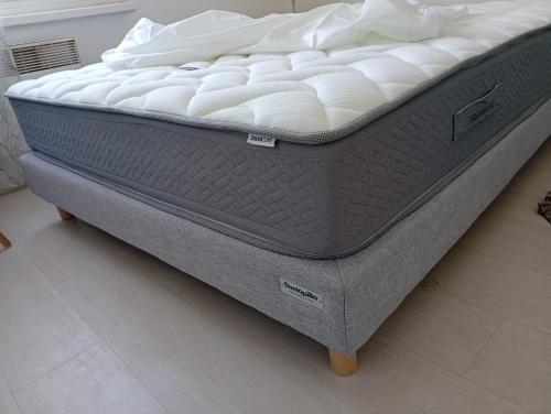 a mattress sitting on a floor in a room at Modern apartment! in Hazebrouck