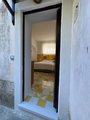 a doorway to a bedroom with a bed in a room at Tender to Carafa in Capri