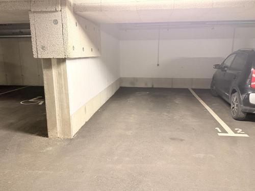 a parking garage with a car parked in it at Ferienwohnung Alpenblick in Innsbruck