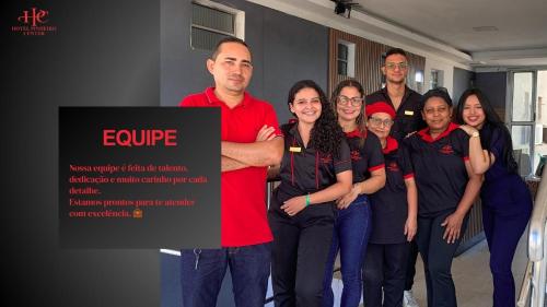 a group of people are posing for a picture at HOTEL PINHEIRO CENTER in Pinheiro