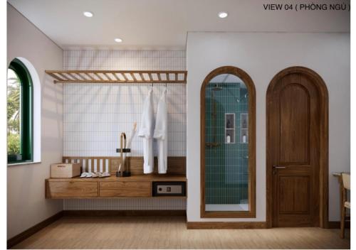 a bathroom with a mirror and a wooden door at Vang Anh Homestay Hoi An in Hoi An