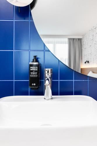 Postel nebo postele na pokoji v ubytování ibis Styles Relax Roznov pod Radhostem