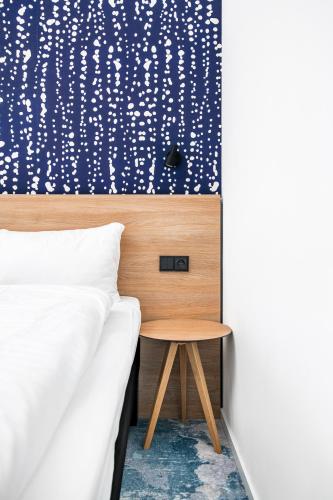 Postel nebo postele na pokoji v ubytování ibis Styles Relax Roznov pod Radhostem