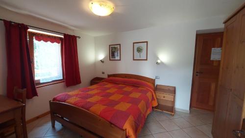 Кровать или кровати в номере maison lo for - casa indipendente