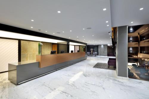 a lobby with a reception desk in a building at Domo Casablanca in Casablanca