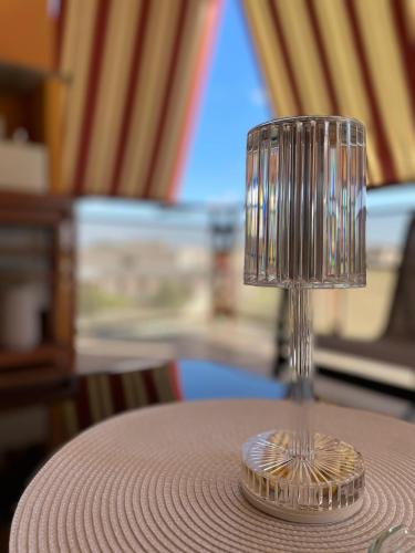 a glass cup sitting on top of a table at Casa Vacanze Anna in Civita Castellana