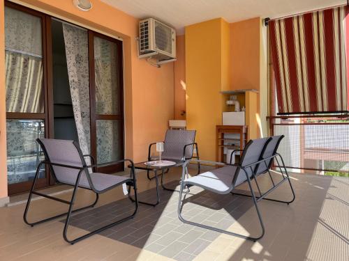 a group of chairs and a table on a balcony at Casa Vacanze Anna in Civita Castellana