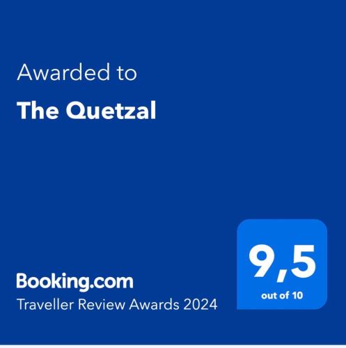 a blue screen with the text awarded to the quik rental at The Quetzal in Cancún