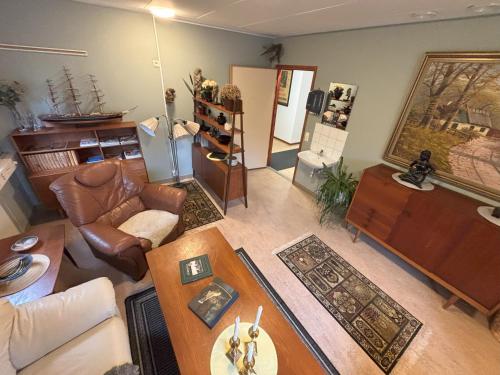 a living room with a couch and a table at Hälsokällans Bed and Breakfast in Kyrkhult
