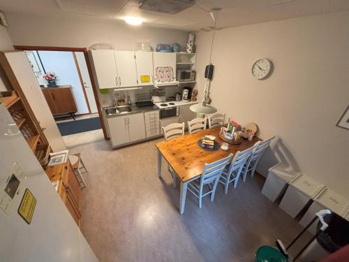 an overhead view of a kitchen with a table and chairs at Hälsokällans Bed and Breakfast in Kyrkhult