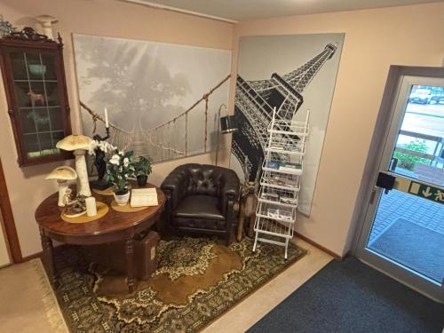 a room with a desk and a chair and a staircase at Hälsokällans Bed and Breakfast in Kyrkhult