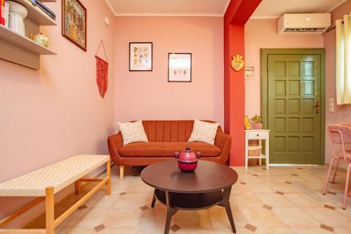 a living room with a couch and a table at Yiayia's Guesthouse in Ipsos