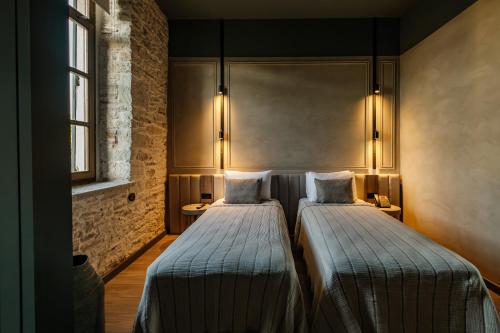 Lecole Hotel By Cityloftにあるベッド