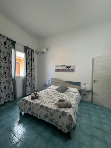 Posteľ alebo postele v izbe v ubytovaní La Veranda