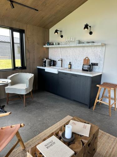 a kitchen with a sink and a counter top at Hvammsvík Nature Resort in Kjósahreppur