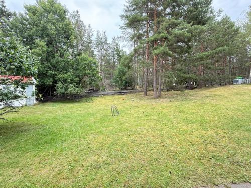 a large yard with trees and a playground at DR ÅSA Apartment Penthouse w Pool by the Forest near a Golf course, Concerts and the Baltic Sea in Järna