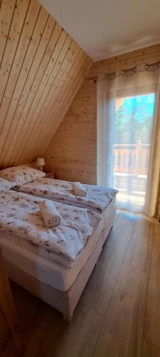 Postel nebo postele na pokoji v ubytování Dom U Eskulapa